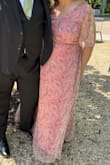 I got so many compliments wearing this dress. As a non-dress wearer I found it very comfortable. I wear 14/16 jeans and can vary from 18-22 in tops but the 2X fit well other than being long. I didn't have time to have it tailored so I wore a thin belt and pulled the fabric up to the length I needed (like a tucked shirt) and it worked great! - Bridget B.