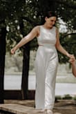 The bust was way too big for me. Because the tailor brought the bust in, the waist got weird folds, so we had to bring in the waist a bit and sew down these wrinkle folds. You can see how that turned out in the back of the second picture. Overall, looks hot as hell! - Diana E.