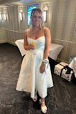 I loved this dress so much for my bridal shower! I'm always between a small and medium and I'm glad I got the small. The dress was so flattering with a fitted top and flared bottom. The skirt has pockets. The fabric is thick and feels more expensive than it is. - Kristy P.