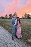Beautiful dress. Perfect for a wedding. I'm 5'4 and I did have to get it hemmed but the dress fit great everywhere else. Straps are adjustable. The back is open. I wore a sticky bra but you probably could go without a bra too. Would definitely recommend this dress for your next summer wedding. - Kathleen M.