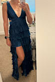 I bought this dress because of all the people wearing it in the reviews looked gorgeous in it! Sure enough it fits perfectly and I'm very excited to wear it at a cocktail formal wedding as a guest in Europe. The ties in the back make the adjustability on top great and there is great padding on the bust. Dress fits great over my hips and the length is a smidge log but will be fine with slightly elevated heels. The fabric also appears that it won't wrinkle when shoving it into a backpack to travel overseas and it's not super heavy either. The only thing I wished was different is having the slit was over my right leg and not my left! I love it and am super excited to travel and wear it. - Julie S.