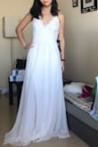 Ordered this dress as a potential wedding dress but it's a bit too casual. It would make a nice rehearsal dinner or bridal shower dress though. The dress was heavier and nicer quality than I expected. Love the front and the flowy skirt. - Wendan L.