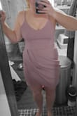 I wore this for a wedding and the material was very comfortable and slid on nicely. I wish it would've covered a little more of my legs but other than that I loved it. Would definitely recommend this dress to others. - Emily P.