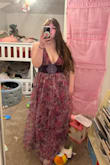 It's super cute when styled. It definitely fits very small. I typically wear a L-XL and needed to purchase the XXL. The color is a bit darker in person than in the photo, but still cute. Would love if the band for the waist was thicker to have a more flattering shape. It is very very long, so if you're short, you'll need heels or alterations. I am 5'7 and it's still very long. Pic with a belt I purchased to go with it, and a pic without the belt. Great quality though! - Lily J.