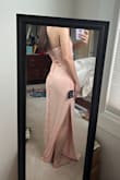 This dress looks nice from far away, but ultimately, it is very cheap-looking in person due to the lack of cups/lining on the top and very thin material on the bottom. The bottom part is so thin and the fabric is so moldable that it might as well be see-through (it's not see through as far as I can tell, but you can see every little contour of your legs/stomach, even seamless underwear is visible). I returned the item. - Madison R.