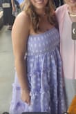 I wore this dreamy lavender dress to a wedding, and it was everything. The light purple color with white floral embroidery is soft, feminine, and flattering perfect for spring or summer gatherings. The smocked bodice is super comfortable and stays in place without needing adjustments, while the tiered skirt adds the right amount of volume and movement. The fabric feels breathable and flowy. I especially loved the ruffle details, they give the dress a playful, romantic touch without being over the top. I got so many compliments. 10/10 would wear again! - Jesse W.