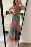 Absolutely beautiful. I am only 5'3" so it is quite long and I need to have it hemmed. But it is very flattering and just as lovely as the pictures - Erin P.