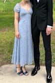 This dress fit perfectly (didn't even need a bra). The ties in the back help it fit you. Got so many compliments and it was comfortable too. Yay!! - Aziza G.
