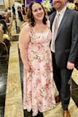 This dress was perfect for a black tie gala on a humid summer evening, light, flowy fabric. It is gorgeous in person, and I received so many compliments on it. The ties/bows on the straps are purely decorative, which meant I had to get the straps tailored to remove over an inch in length so they wouldn't fall off my shoulders and to bring the bust & waist up, but I have a smaller chest compared to others my size. For reference: I'm typically between a 1x/2x, size 18. I thought the 2x was perfect with enough room to be comfortable, sizing down would have fit, but likely been too tight to be comfortable all night. Added bonus, I could wear a regular bra with the dress and used the ties/bows to tie my bra straps to the dress straps so they moved together and never showed. - Amanda L.