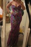 It's very pretty, I opened it up and sequins were already falling off from the packaging. The dress was a little big on me. I contemplated ordering a medium but ultimately went with another dress bc of time. The dress is very long, I'm 5'7.5", and even with 3" heels, it was too long to the point. I couldn't walk without almost tripping. - Kelly O.