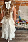 Loved this dress for my bridal shower! Mine did come with a small tear in the side of the waist, but wasn't noticeable. Runs pretty true to size! - Rylee K.