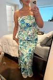 There weren't a lot of reviews when I ordered, but they said the dress ran small. According to the size chart, my bust was a L, but waist and hips are right between a L and XL. With this and the fit finder saying I'm an XL, that's what I ordered. The waist fits okay, although not tight like a corset top typically is, but the bust is barely touching my chest, and the hips fit perfectly. I would try exchanging for a L, but then I'm worried the slit would be way too high because it's already as high as I'm comfortable with (comes to where my fingers are in the picture). Planning to just have it altered because it is a beautiful dress, and the material is super comfy and has some stretch! - Victoria D.