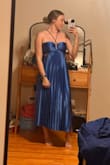 The fit is a little large in the boob area but overall fits well with double sided tape so it won't slide down. Love the pleating and reflective fabric. - Shannon M.