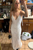 Dress is cute but sooo heavy. I suppose the beading makes it very heavy and feels awkward to move in. - Jordan G.