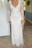 I couldn't be happier with my wedding dress! It fits like it was custom-made for me, absolutely perfect in every way. The quality is far beyond what I expected for the price. The fabric feels luxurious, the stitching is flawless, and the overall design is stunning. I've tried on dresses that were triple the cost and didn't come close to how beautiful and well-made this one is. Highly recommend to any bride looking for elegance without breaking the bank! - Elena B.