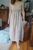 I loved this dress and it really looked and fell just like it was pictured. The top was snug in just the right way, I did still wear it with a strapless bra though. I am on the shorter side so a small fell just at my ankle but I still did fine wearing flats/sandals to give it a more casual look. Nevertheless, it was still really elegant as it flows a bit large due to the cut, but I love that about it! The fabric doesn't wrinkle much either even with packing it in a suitcase (it was my high school reunion!) and it was super comfortable. I couldn't be happier with the purchase, I wish they made the same dress in different colors/patterns I would buy them all!!!! - Jennifer N.