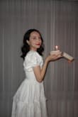 I got this dress for my 25th birthday, and it was so feminine and girly, I felt like a princess! The length was a bit longer than I had expected, but I loved it regardless, it was about a midi dress length on me. The sleeves are puffy and cute, which adds to the princess feel, and the waist does have a bit of give/stretch to it, which makes it more comfortable to wear! - Caitlin H.