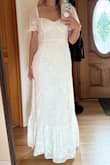 I tried this dress on and loved it immediately. The quality feels great, and the fabric and design are beautiful. I love that the size is adjustable, thanks to the strappy back. I was looking for something playful yet modest for my wedding reception with my fiancé's family, and this fits the bill. - Tanya A.