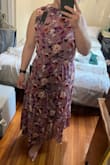I am typically between sizes, so I sized down. However, it was still too big on the waist, and the waist of the dress was positioned below my natural waist, which was quite unflattering. The material is decently made, but there's something strange about this color combination in person.. Overall, it's a cute dress but without petite sizing, it doesn't really work - Joanna C.