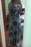 I love this dress, the color/pattern is so beautiful and it very light and flowy. I like how you can adjust the back so that the bust fits better. I am 5' 7" and I will probably still need to get it hemmed a few inches even with heels, but that's not a big deal. I am very excited to wear it to prom. - Leah M.