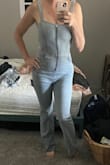This jumpsuit fits like a glove. I bought it, but haven't worn it yet. Hopefully I have somewhere to wear it in the near future lol. I am on the taller side and it is long enough which is great. - Lauren V.