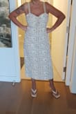 I love the length, the material, and color. The top fit me, but did not accent the bust area. I ended up cutting the strings that go around your neck and sewing each one for straps instead of tying into a halter style. It kept everything in place. Cute dress. - Michelle O.