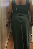 I love the color and fabric of this dress. It's vibrant and feels well made. Most importantly, it fits well with one exception. There is a significant amount of bunching along the zipper in the back. The fabric isn't stretched too tightly because I purposely bought a size larger than I needed, and I'm able to step into the dress easily. I'm hoping a seamstress will be able to correct it in time for my event - Dawn B.