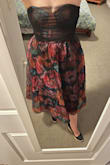 Don't hate it but also don't adore it. It was better in photos than in person. Ordered for a friend's July garden wedding. Am normally a small but took advice and sized up to medium. It zips but don't have a lot of wiggle room. Skirt poof makes you look bigger on the bottom - Melissa L.