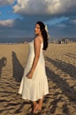 The dress was very well made and thick, but I was able to wear it to the beach. I usually am in between a medium and large, but decided to go with large, and it was perfect! - Merlyn T.