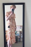 Pleasantly surprised by this dress! I can run between small and medium, and the small fits (though I haven't sat down in it much, so we'll see how the waist feels then..) I love the tie feature because I'm smaller-chested, and it's nice to be able to adjust. The side slit could be higher but overall cute dress! It is flowy enough but flattering on curves. Fabric feels nice too! I'll be wearing this to a wedding later this summer. - Elsa H.