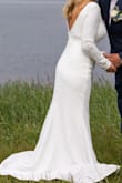 I bought this dress last minute. It arrived quickly. The material is heavy, which was perfect for my outside wedding 60 degrees. The material has a little stretch so very comfortable. The sleeves were just a little long, but I thought it looked classy. It was a tiny bit long, but I was wearing flat shoes. - Rena H.