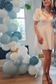 This dress was perfect for my bridal shower! I loved the sleeves and the wrap top was very flattering. The material was slightly crinkly, which was actually nice to hide any wrinkles from transport. A quick steam helped to even everything out. If you have wider-set shoulders, you may have a hard time keeping the sleeves on your shoulders given the wrap style, but I had no problems personally. I will likely wear this dress to another pre-wedding event because I loved it so much! - Hayley C.