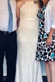 Wore this dress for my wedding! It was absolutely beautiful and I received so many compliments! The dress fit great, it was a little long but with my heels it was perfect. The only complaint I have is that the zipper stuck out a little from too much bunches up fabric. I took it to the tailor and it was an instant fix and looked perfect! - Sarah H.