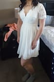 I was a little worried about purchasing a dress online but it fits perfectly! The top portion of the dress is just beautiful and I love the short sleeves. The dress is little shorter that I would have liked but I was expecting it. I ordered this one and another one for my wedding and I LOVE them both, still not sure which one I'll pick. - Stephanie F.