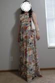 A very comfortable to wear fabric, great for spring, garden, or boho chic vibes. The bust area is roomy but does enclose your breasts just enough to pass as modest from the side, and the waist is fitted, definitely the tightest area. No boning. I'm usually a 8 or 10 (M), rectangular shape. I tried this in both M and L. I was able to fit into both but I ended up choosing the L. The M was lighter and tighter against my bust contour but I liked it more when the front was a bit flatter and looser. I kind of like the extra weight from the L, too. For some reason the L sat at a higher bust line on me than M when I marked it with tape. The hem line is ridiculously long even with my highest heels on, so would probably need to get it altered. Overall, would recommend this dress if you have time to get it altered for a better fit. Like other reviewers have mentioned, there is a seam down the middle so the print pattern is not continuous in the front, but it didn't bother me that much and it's not noticeable from afar. - Anonymous 8.