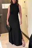 This dress has two slits and is very flattering-flows on the bottom and not tight on top. - Tonya M.