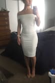 I recently got engaged and am planning on wearing this to my engagement party. I was worried that since it's white it would be see-through, but it's not at all! It is so classy and elegant! I knew I wanted a form-fitting dress for the occasion, and I think this is perfect because it isn't too short and doesn't show cleavage (family will be present). I think the off-the-shoulder look is very flattering on anyone. I plan on wearing nude underwear, along with nude heels and statement earrings with my hair in a French twist. - Lauren C.