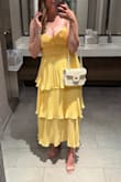 This dress is super cute, and a really nice color. I wore it to a summer wedding and got lots of compliments! It runs a little small, but based on other reviews I did order a large for this reason, so it fit well. The bust area/corset was a little awkward fitting, I had to lift my boobs up with boob tape because a bra wasn't really an option, and the middle part below the bust would get bunched up really easily. But still a super cute dress! - Casey S.