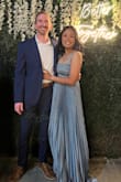 The dress runs a little tight under the chest area and very long. I am 5'3 and I was wearing 3.5" heels and the dress still dragged on the ground. 
Overall, I like it and would have purchased the next size up. I ordered a medium. - Grace L.