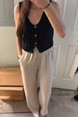 I've bought A LOT of knit tanks this summer, and this one is by far my favorite. The deep navy is stunning, and the length/fit is perfect. I would 100% recommend buying it. - Regina R.