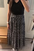 I ordered this skirt for work and fortunately the slit is not as high as it seems. It's the perfect length and hits the lower ankle without dragging on the ground. Perfect for brunch, church, or a little picnic date! - Regina R.