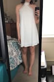 The dress fits very well. I thought it was a bit longer than it looks in the photo. Also since the dress is white you can just barely see through it even with there being two layers. Definitely need a sticky bra for this dress. Decided to go with a different dress. - Logan S.