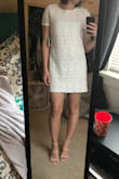 The dress was made a nice material and fit well.  I wish it had more shape to it but it is a shift dress so it doesn't have much shape to it.  Really wanted to like this dress as it looks super cute in the photos but ultimately sent it back and went with another dress for my graduation. - Logan S.