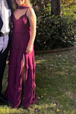 Beautiful and well made dress. A little large in the bust (I'm a B cup), but I used fashion tape to hold it in place. Straps were also long, but was easily able to hem them. Looks great on. Color is more of a Merlot red in the sun and purple in indoor lighting. - Ella C.