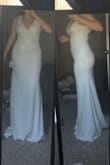Long for 5ft4 (164cm) and the area around the bust is very loose. The straps kept falling down on me. But if I sized down, it would be too tight around the waist. So I had it tailored to fit more around the bust and hem it shorter. Perfect for a simple courthouse wedding or outdoor bridal shooting/events. Classic and elegant on an hourglass body - Heather D.