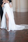 I used this as my elopement wedding dress, and it was gorgeous! No one tells you that wedding dress sizes can be a mood killer, because even at size 10, I felt snug but nonetheless super beautiful. The dress photographs well and the slit it sexy but also the style of the dress is so classy. - Areli T.
