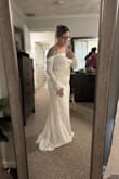 I thought the dress was absolutely beautiful and would fit my rustic vibes. But it is SOOOOO ITCHY in the upper breast section and arms. Also, you can't lift your arms past a certain point because of the sleeves. Would not be able to hug my guests. Also had a really hard time with the zipper getting caught. - Laurelis M.