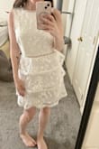 Got this dress for my bridal shower and it is so so cute. It looks exactly like the photo. The armpit area has a bit of a gap so I will just wear stickies because a bra would show on the sides on me (you do need a bra with this dress in my opinion.) I think it's really unique and pretty. I gave it a 4/5 because I can't say it's the most comfortable dress ever but would still recommend. :) - Alison M.