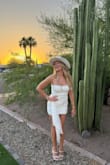 The dress was so flattering, and the tie in the front is the perfect touch to make it fancier. True to size but stretchy and won't show your bloat - Sarah P.