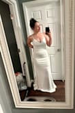 My husband and I decided to elope after 10 years of being together. I ordered this dress a little more than a week before our elopement, and it ended up coming the day before. I tried the medium on and immediately fell in love. The fit of the dress and the length was everything I was looking for. The ONLY down side, are the straps. If you need them much tighter like I did, they will be visible if you have short hair. My husband loved it and our girls loved it too. I had some oddly made spanx on underneath so that's what that line is across the butt. - Moriah W.